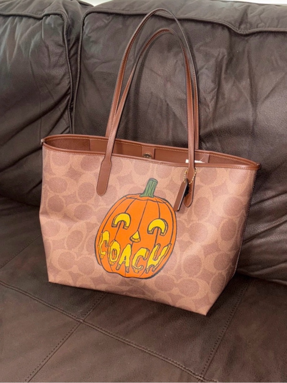 Coach Brown Signature Canvas Tote with Orange Pumpkin Graphic